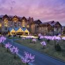 Gayloard Rockies fron exterior view with christmas lights at sunset. 