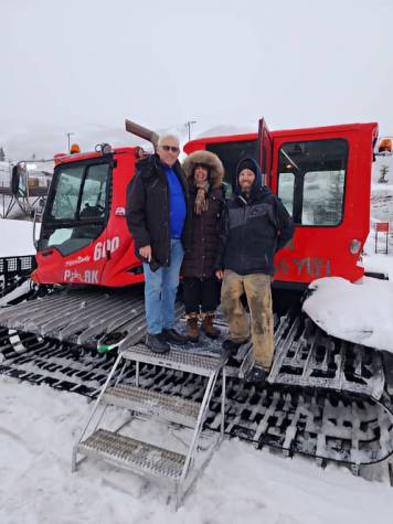 Greg and Susan Sims with the snowcat driver getting ready to take the trip up to the yurt