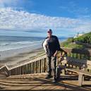 Greg with Honey overlooking the beach