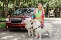 Jo-Anna Hehir with her two Great Pyrenees deliver packages for Amazon Flex