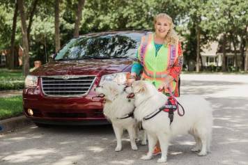 Jo-Anna Hehir with her two Great Pyrenees deliver packages for Amazon Flex