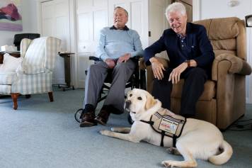 Sully, an America&rsquo;s VetDogs&rsquo; service dog lends a helping paw to a former president.