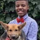 Darius Brown and dog with one of his bow ties