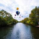 Hot air balloons hanging over the Boise River